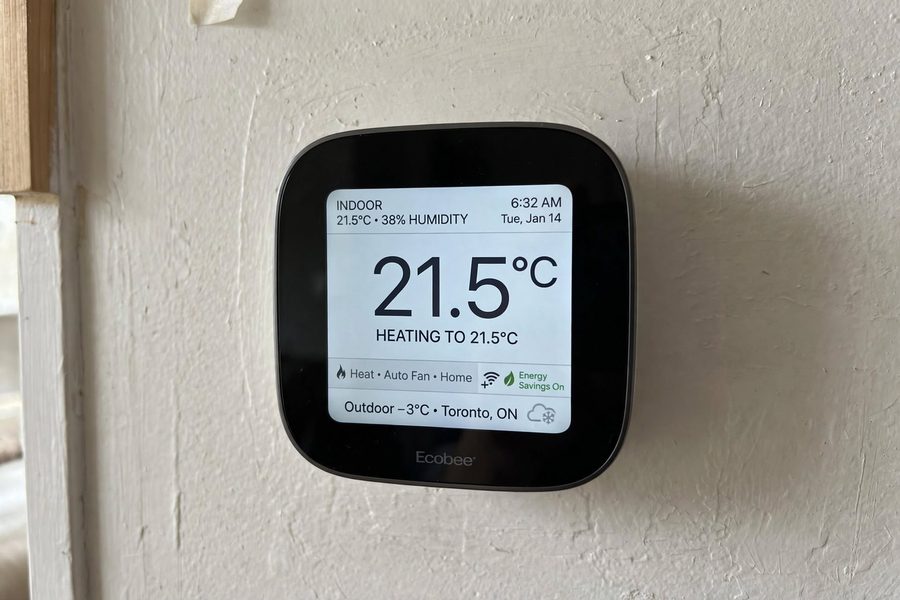 Smart thermostat on wall